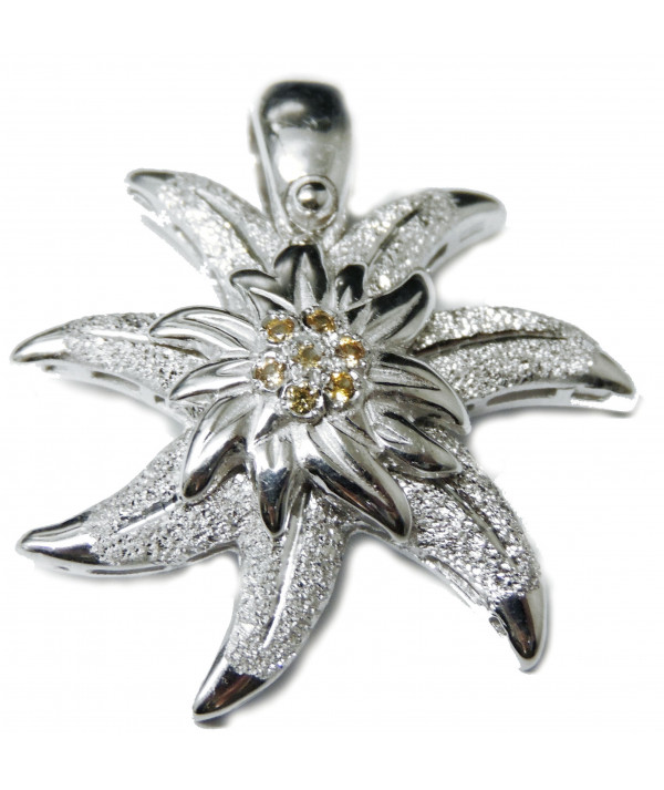 Pendentif en argent925/000 avec un motif edelweiss son coeur est serti de saphirs jaunes Joly-Pottuz//Megève//