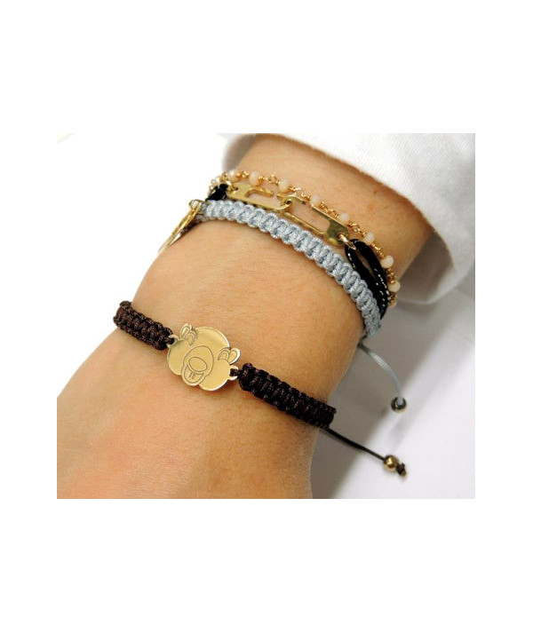 Bracelet tressé avec motif marmotte en or jaune