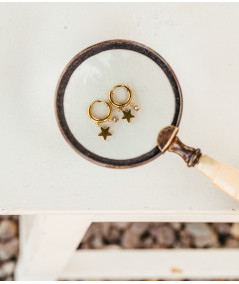 Boucles d'oreilles créoles  avec une étoile et un zirconium en acier doré Zag//Joly-PottuzMegève//