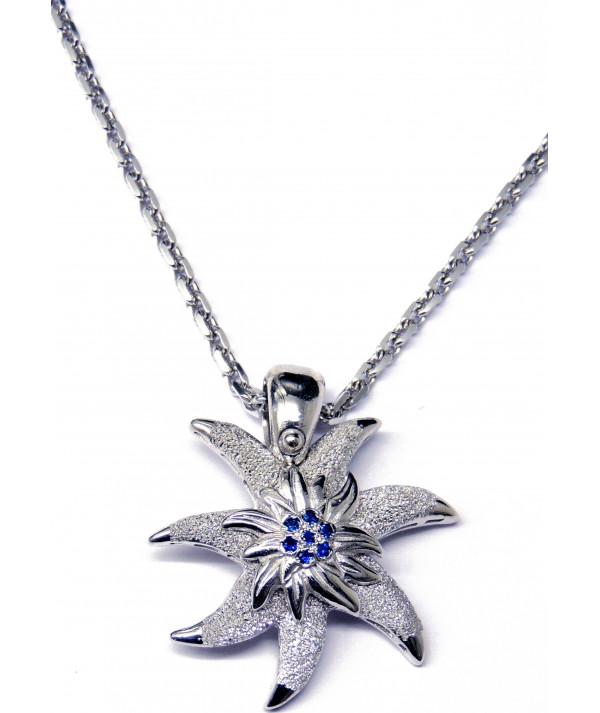 Pendentif Edelweiss en argent925/000 son coeur est serti de saphirs fins Joly-Pottuz//megève//