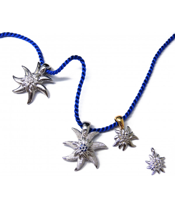 Pendentif Edelweiss en argent925/000 son coeur est serti de saphirs fins Joly-Pottuz//megève//